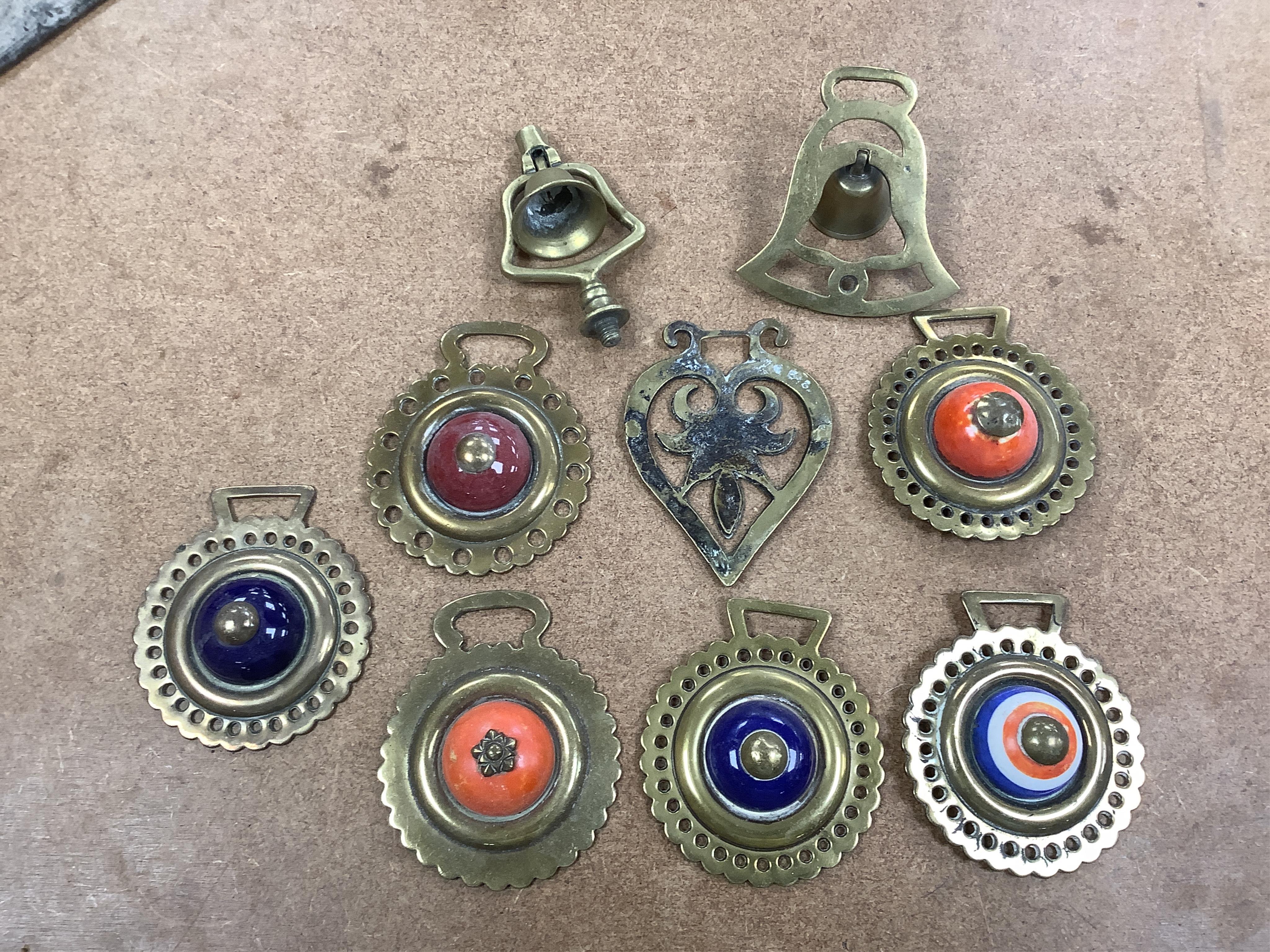 A collection of various horse brasses